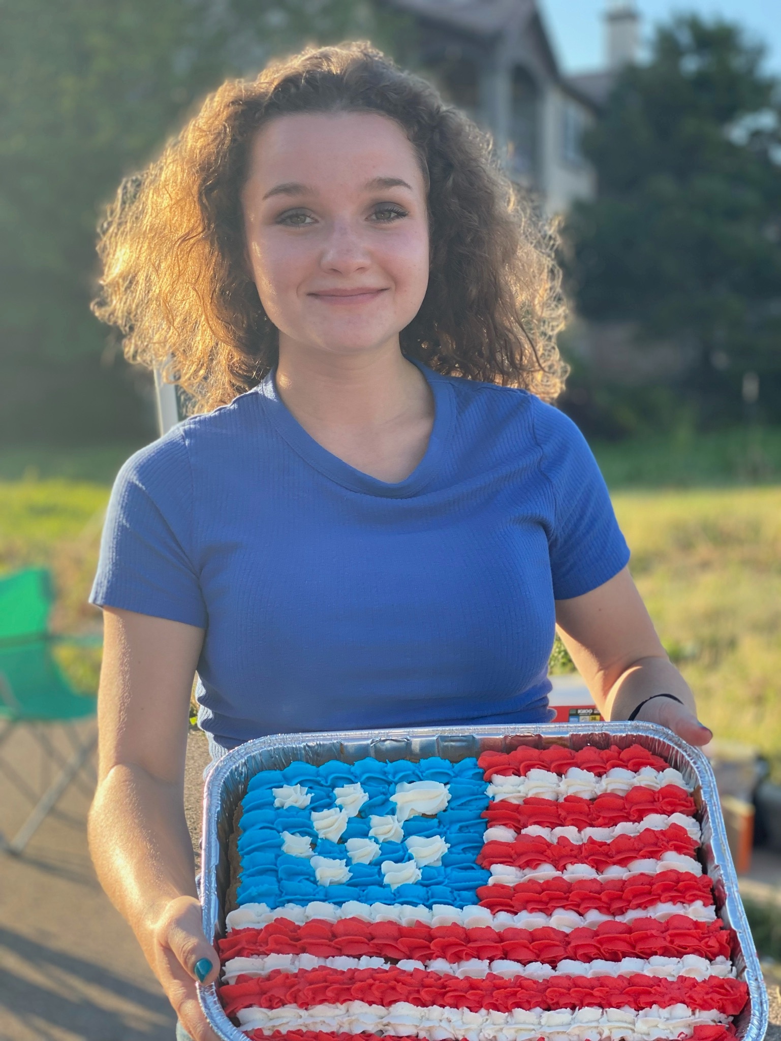 Julia holds 4th of July Cookie Cake